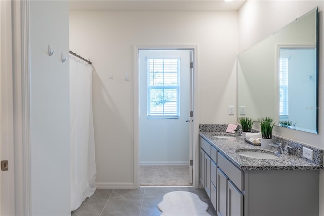 bathroom with vanity and tile patterned flooring