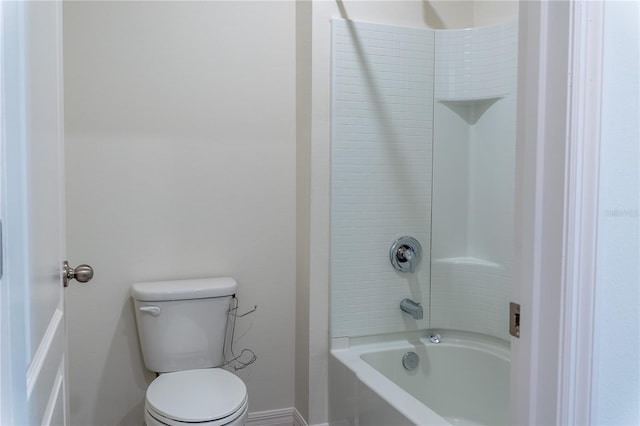 bathroom featuring toilet and tub / shower combination