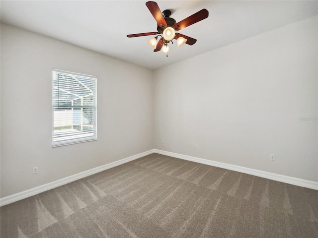 spare room with carpet flooring and ceiling fan