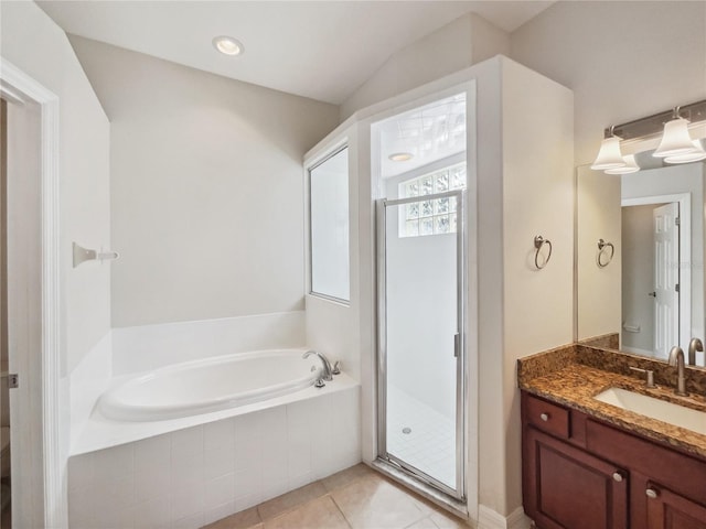 bathroom with vanity, tile patterned floors, and shower with separate bathtub