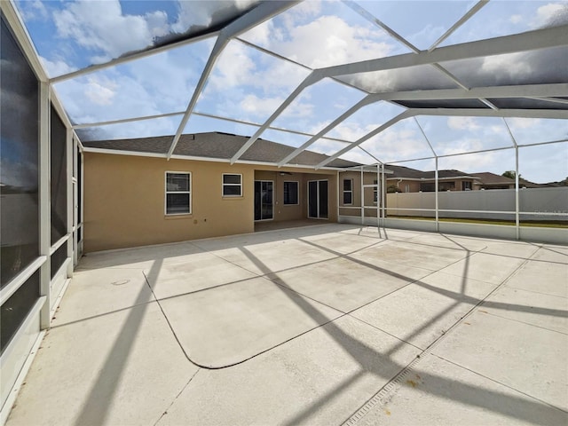 unfurnished sunroom with vaulted ceiling