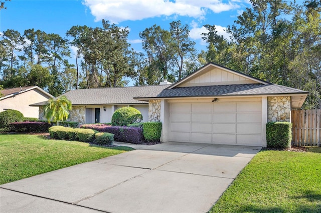 ranch-style home with a front yard and a garage