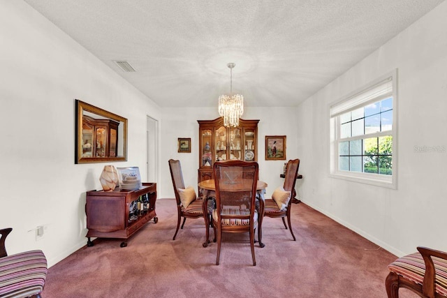 734 Riverbend Blvd, Longwood, FL 32779 - carpeted dining room with a chandelier, baseboards, and a textured ceiling
