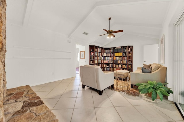 734 Riverbend Blvd, Longwood, FL 32779 - living area featuring vaulted ceiling, light tile patterned floors, ceiling fan, baseboards, and built in features