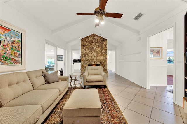 734 Riverbend Blvd, Longwood, FL 32779 - living area with a ceiling fan, light tile patterned flooring, and a stone fireplace