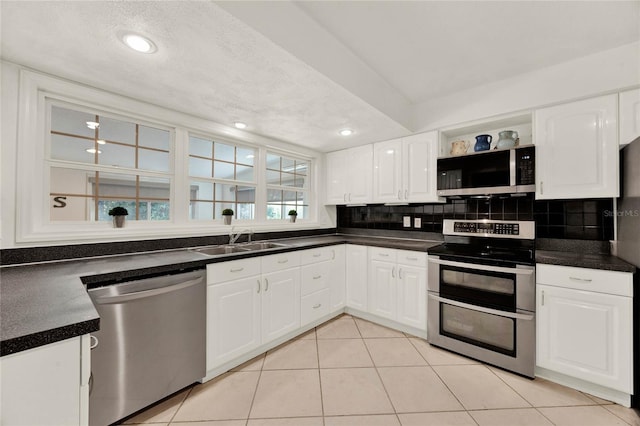 734 Riverbend Blvd, Longwood, FL 32779 - kitchen featuring stainless steel appliances, a sink, open shelves, white cabinetry, and recessed lighting