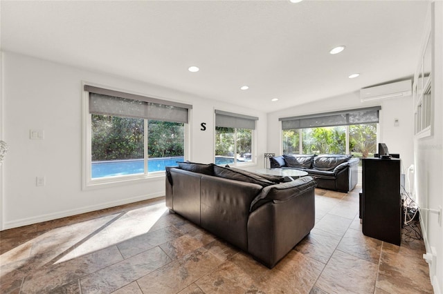 734 Riverbend Blvd, Longwood, FL 32779 - living area with an AC wall unit, healthy amount of natural light, stone tile flooring, recessed lighting, and baseboards