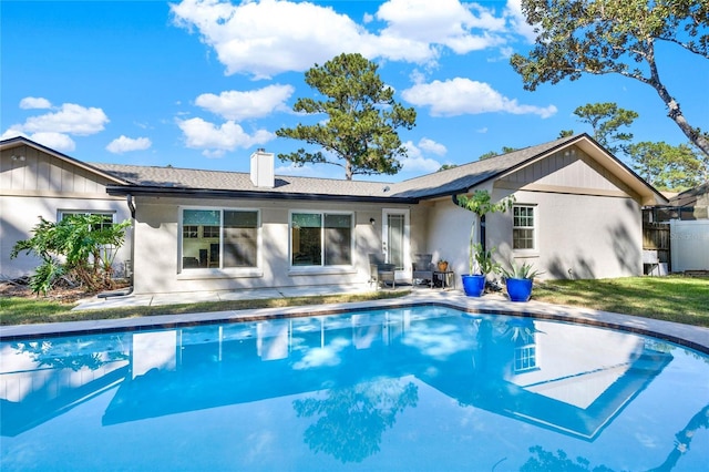 734 Riverbend Blvd, Longwood, FL 32779 - back of house with an outdoor pool, a chimney, and a patio area