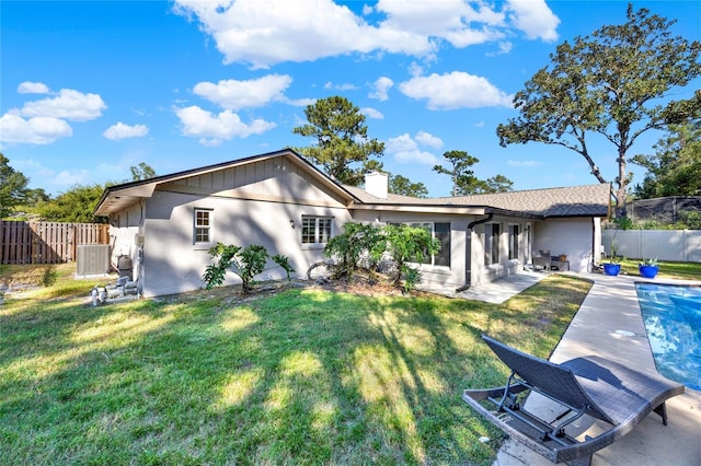 734 Riverbend Blvd, Longwood, FL 32779 - back of house featuring a chimney, stucco siding, and a patio area