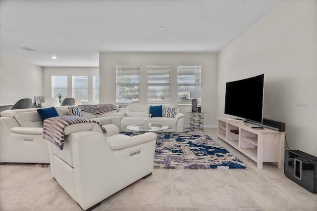 living room with a textured ceiling