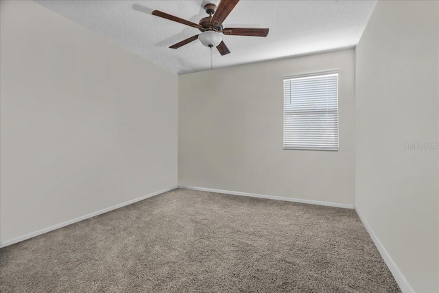 carpeted empty room featuring a textured ceiling and ceiling fan