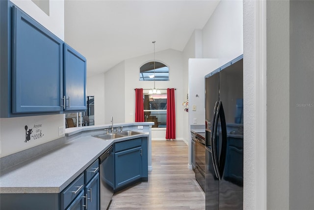 kitchen with black appliances, sink, blue cabinets, lofted ceiling, and light hardwood / wood-style flooring