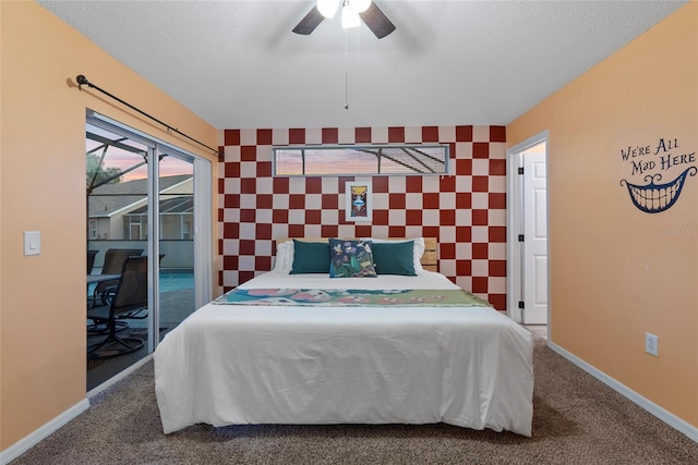 carpeted bedroom with a textured ceiling, access to exterior, and ceiling fan