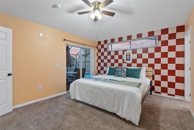 bedroom with a textured ceiling, carpet floors, access to outside, and ceiling fan