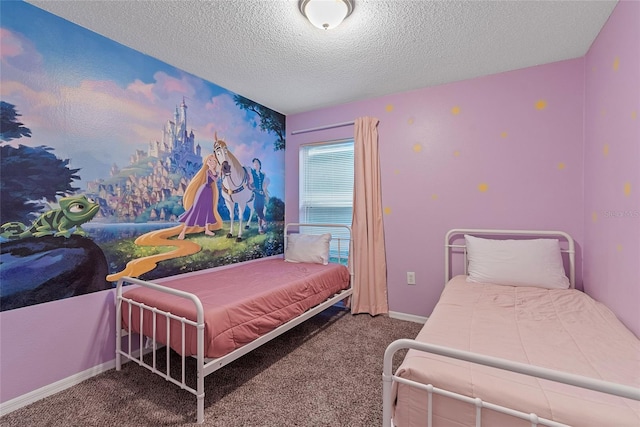 bedroom with a textured ceiling and carpet flooring