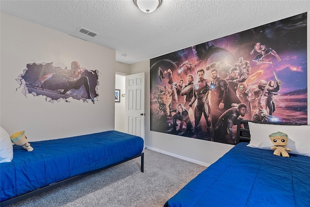 carpeted bedroom with a textured ceiling