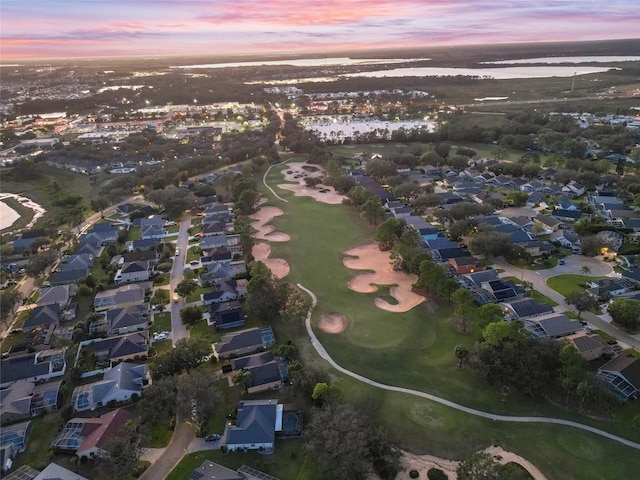 aerial view at dusk with a water view