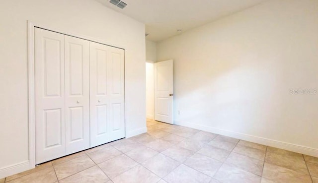 unfurnished bedroom with a closet