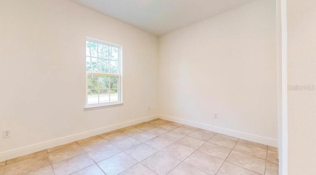 empty room featuring light tile patterned floors