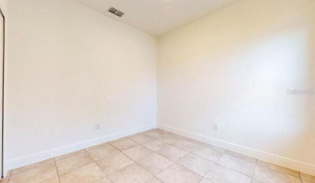 spare room with light tile patterned floors