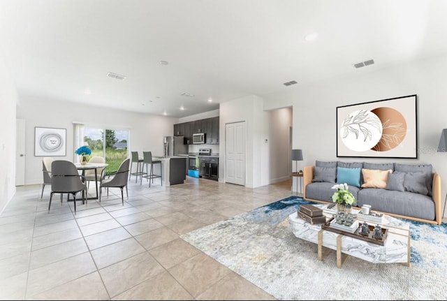 living room featuring light tile patterned floors