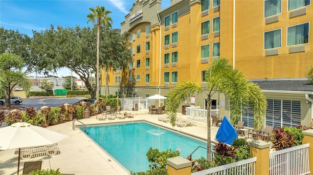 view of swimming pool with a patio