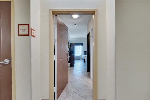 hall featuring light tile patterned floors