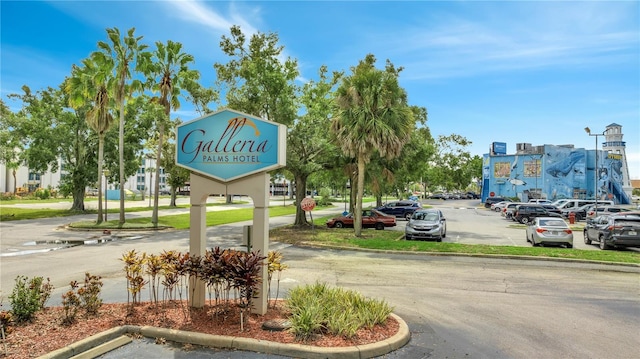 3000 Maingate Ln Unit 113, Kissimmee, FL 34747 - view of asphalt road featuring curbs and street lights