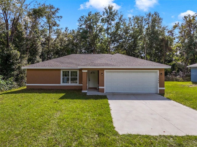 single story home with a garage and a front lawn