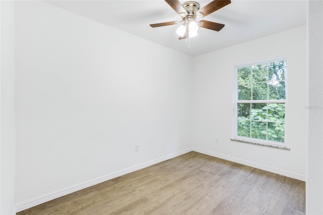 spare room featuring light hardwood / wood-style floors and ceiling fan