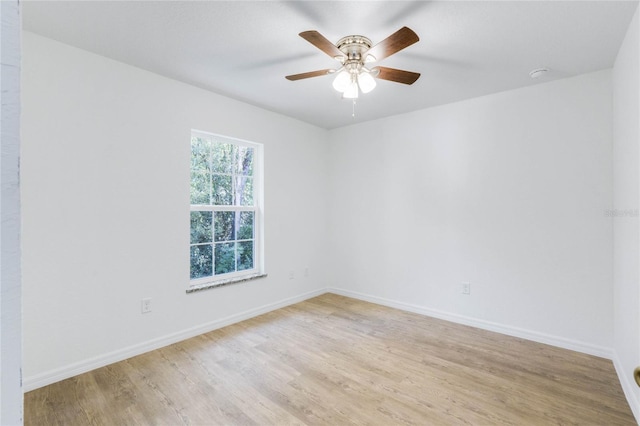 unfurnished room featuring light hardwood / wood-style flooring and ceiling fan