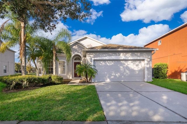 view of front of house featuring a front lawn and a garage