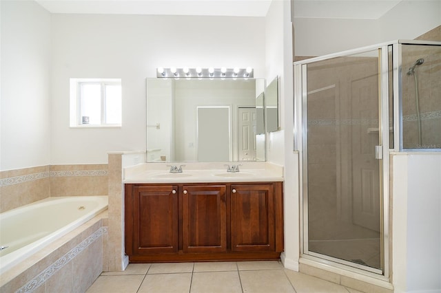 bathroom featuring vanity, plus walk in shower, and tile patterned floors