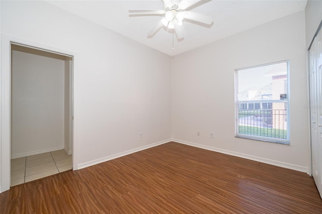 unfurnished room with ceiling fan and hardwood / wood-style floors