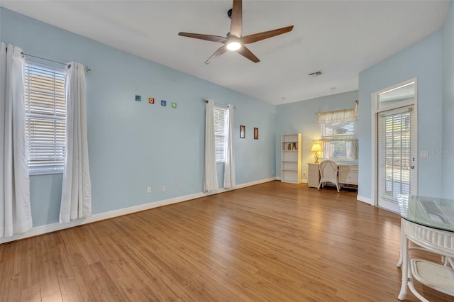 interior space with wood-type flooring and ceiling fan