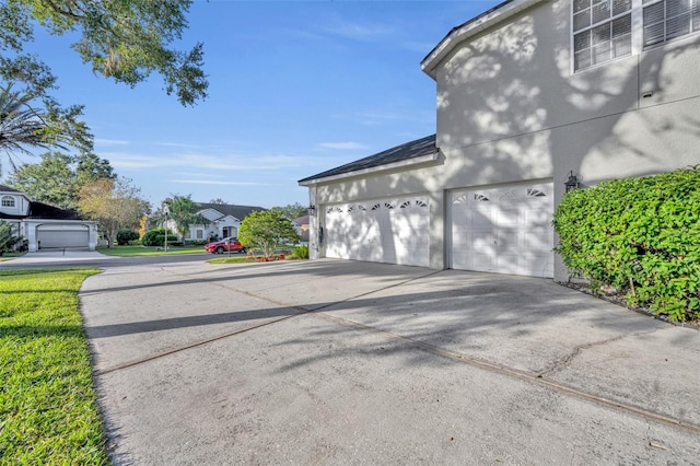 view of side of property with a garage