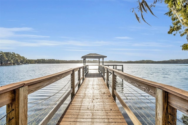 dock area featuring a gazebo and a water view