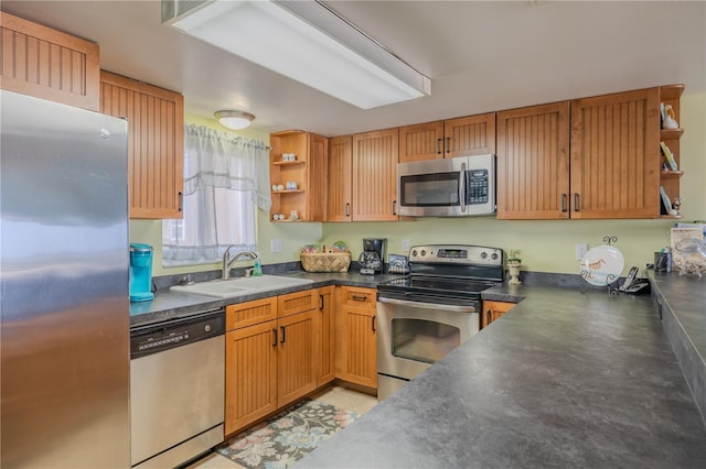 5501 S Atlantic Ave Unit 307, New Smyrna Beach, FL 32169 - kitchen with a sink, dark countertops, open shelves, and stainless steel appliances