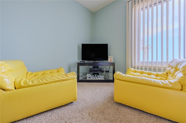 5501 S Atlantic Ave Unit 307, New Smyrna Beach, FL 32169 - living room featuring carpet and lofted ceiling