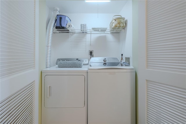 laundry area featuring washing machine and clothes dryer