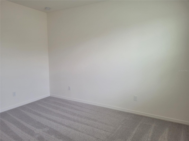 unfurnished room featuring carpet floors