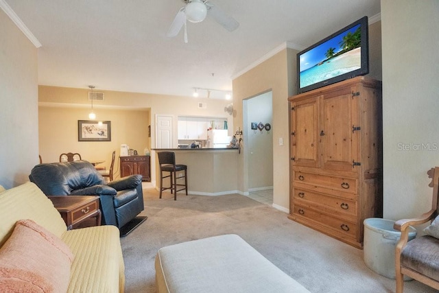 living room with light carpet, ornamental molding, and ceiling fan