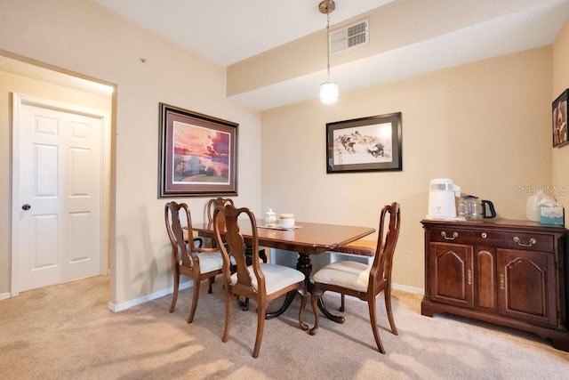 view of carpeted dining area