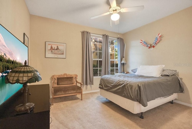 bedroom with light colored carpet and ceiling fan