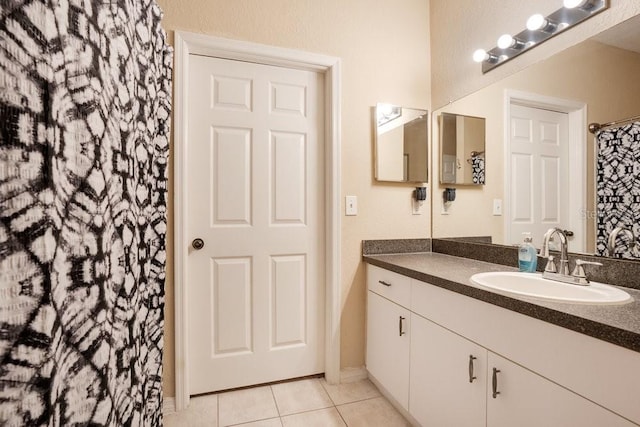 bathroom with vanity and tile patterned flooring