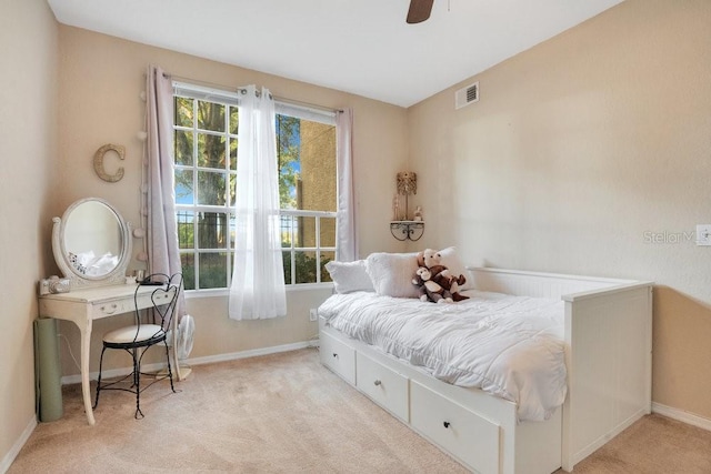 bedroom with light colored carpet and ceiling fan