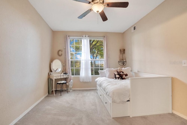 carpeted bedroom with ceiling fan