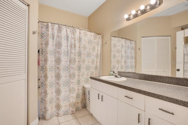 bathroom with vanity and tile patterned floors