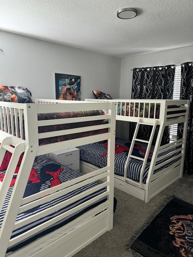 carpeted bedroom with a textured ceiling