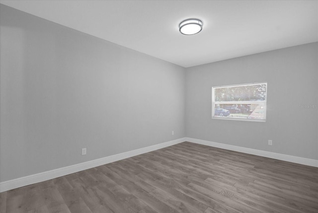 unfurnished room featuring wood-type flooring